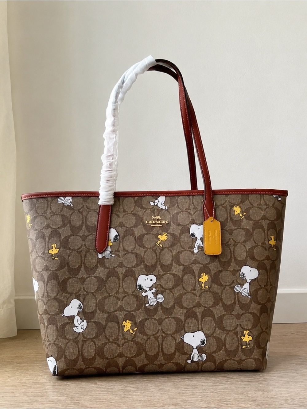 Coach Brown Signature Canvas Tote with Red Trim and Yellow Charm